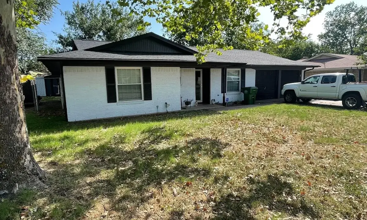 Professional roofing crew working on a residential roof in Roseville